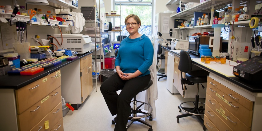 person seated between two lab benches